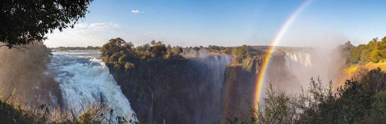 Panorama of Victoria Falls with the Zambezi pouring into the gorge