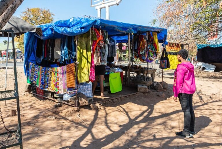 Craft stalls with colourful fabrics in Kasane, Botswana