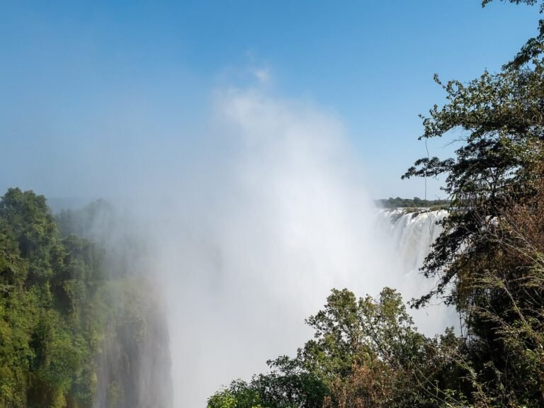 Spray rising from Victoria Falls beside Livingstone Island, Zambia