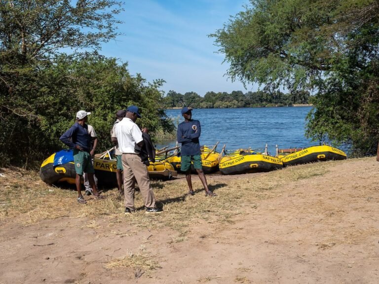 Rafts and guides preparing at the Zambezi riverbank