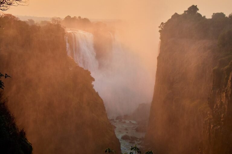 Golden light on Victoria Falls and the steep basalt gorge