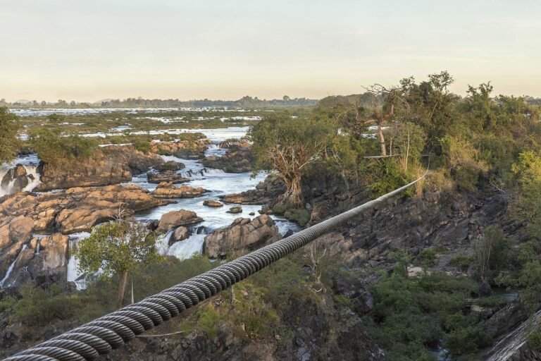 Zip line cable stretched over a rocky river gorge